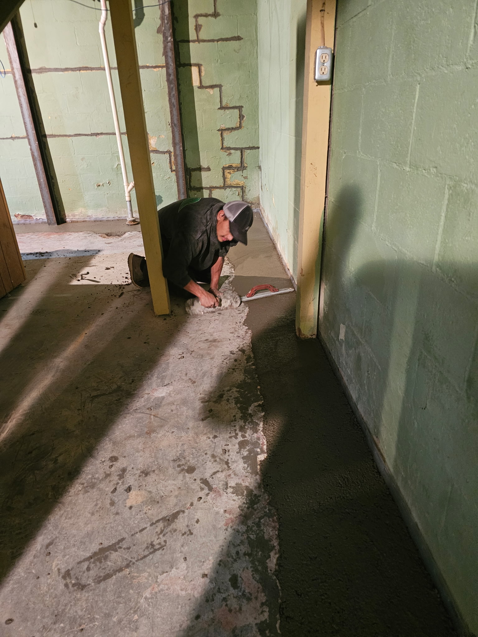 Bettendorf basement during the waterproofing and foundation wall stabilization project