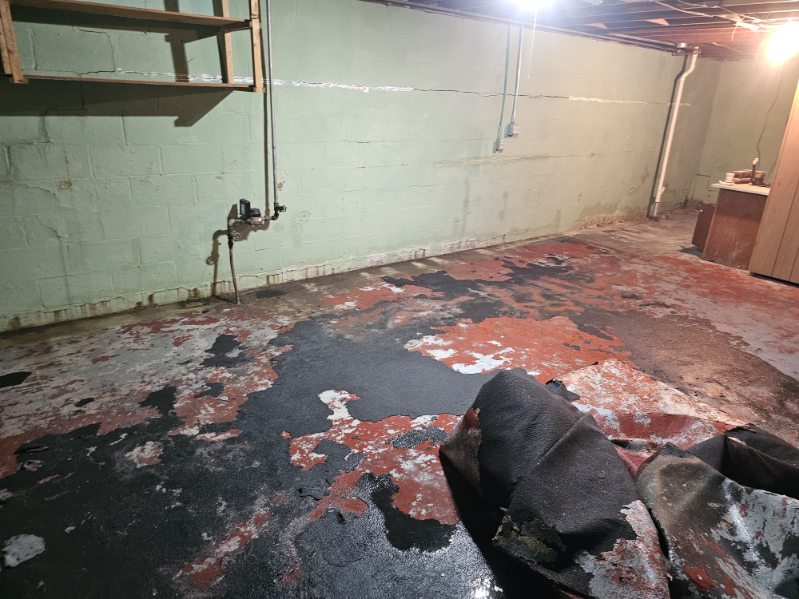 Bettendorf basement during the waterproofing and foundation wall stabilization project