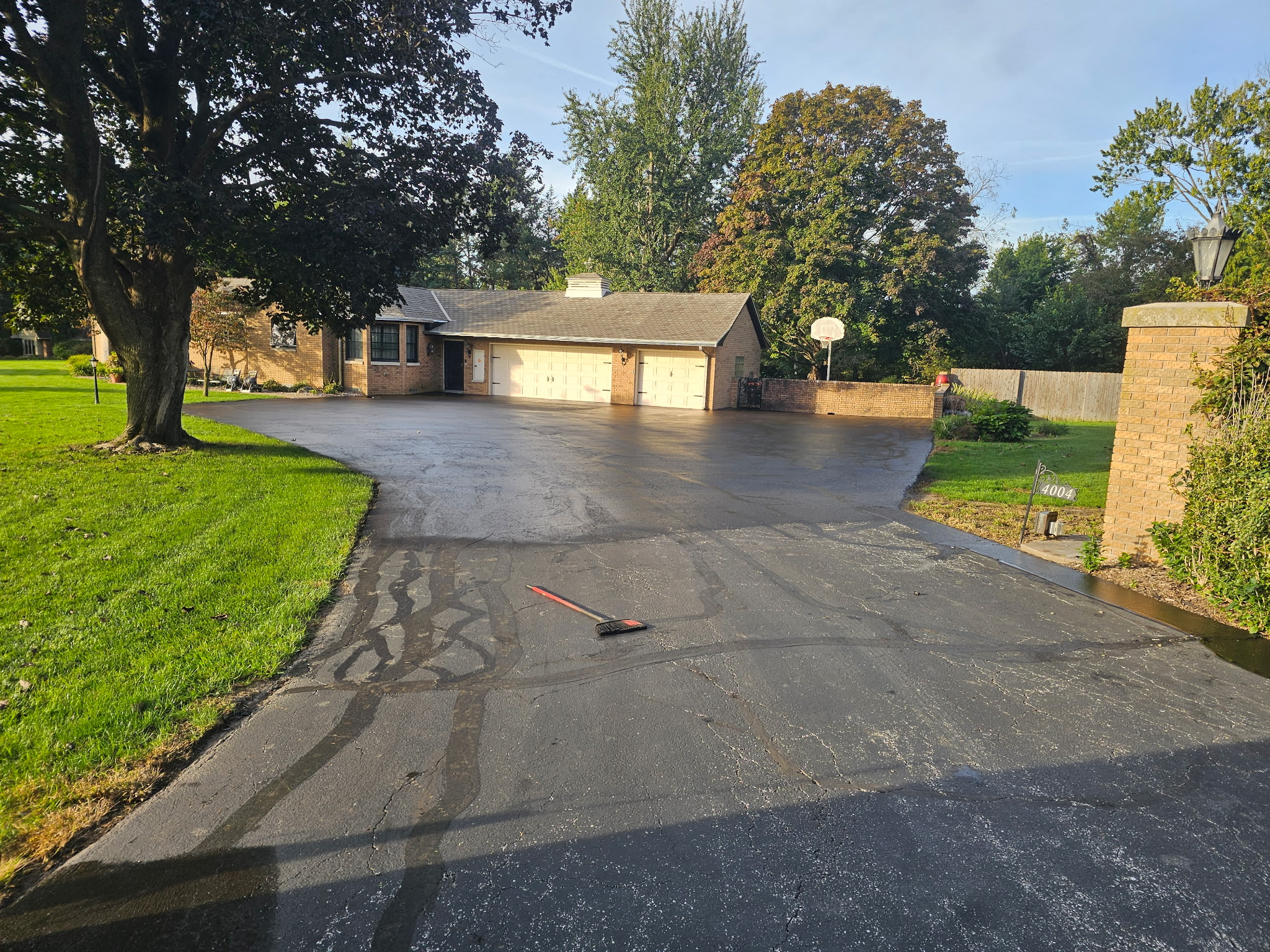 Sealcoated driveway at the garage with the finished black surface