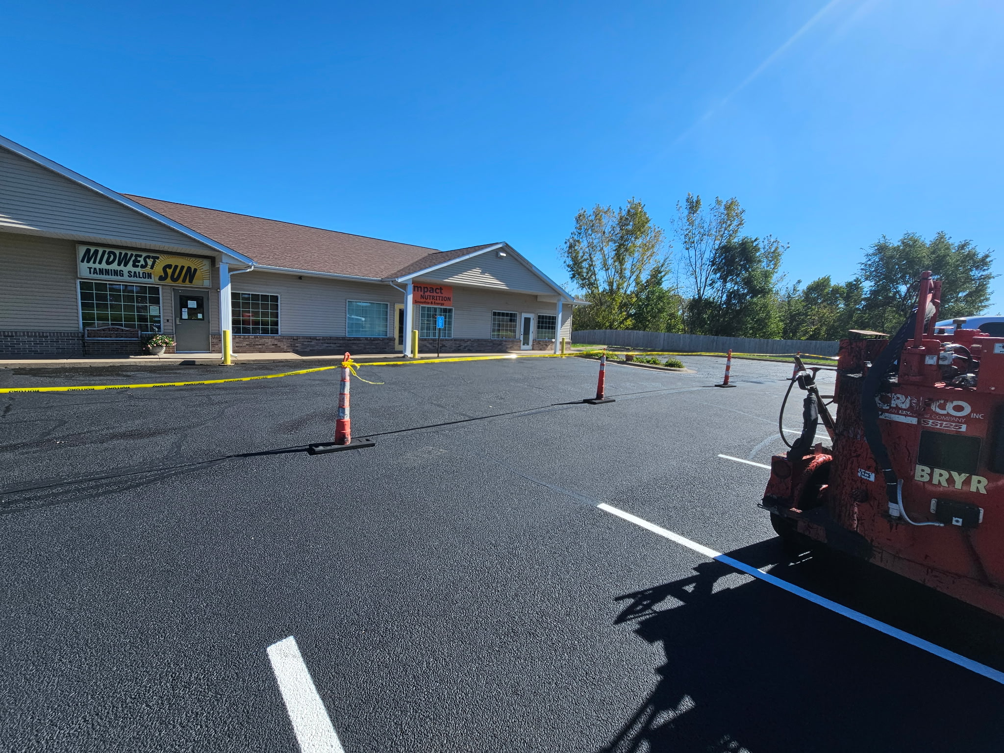 Commercial parking lot in Davenport during the sealcoating and crack-filling project