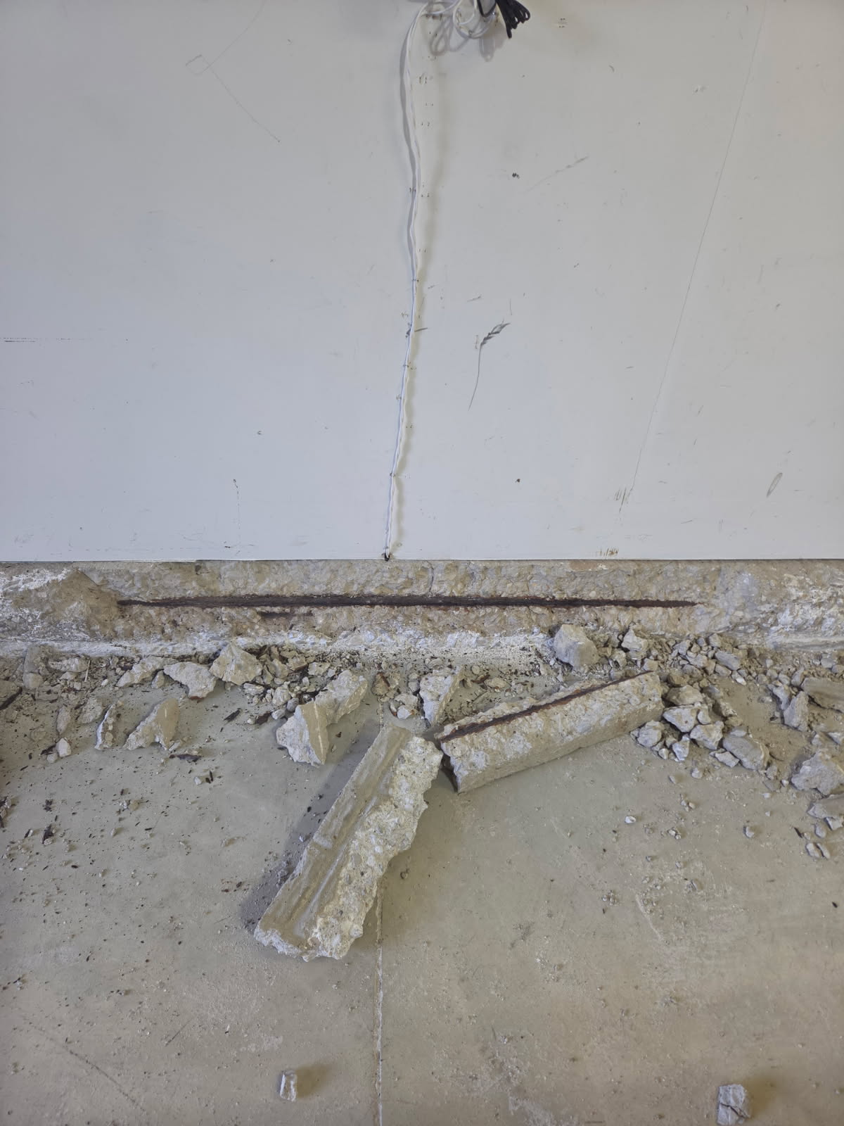Loose and broken concrete removed from the stem wall
