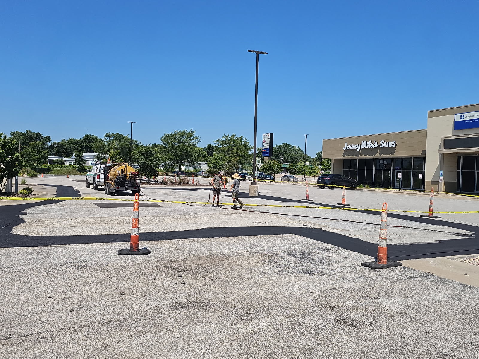Commercial parking lot off Jersey Ridge Road in Davenport during the phased sealcoating project