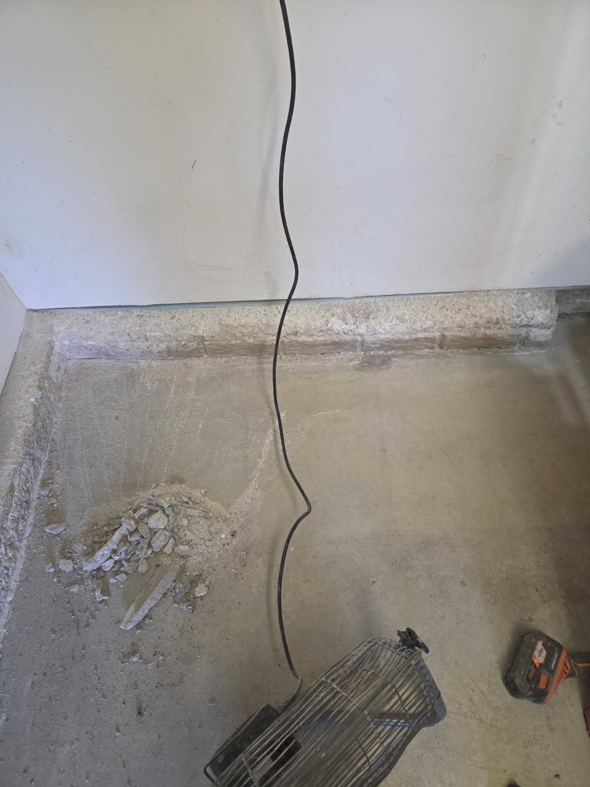 Crack in the deteriorated concrete stem wall before repair