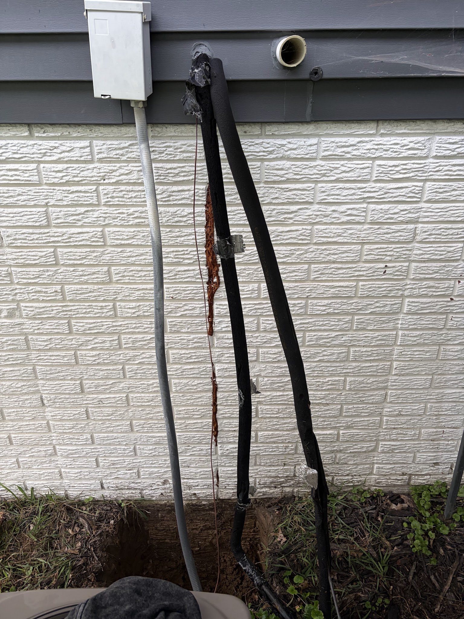 Failed foam injection residue running down the foundation crack before repair