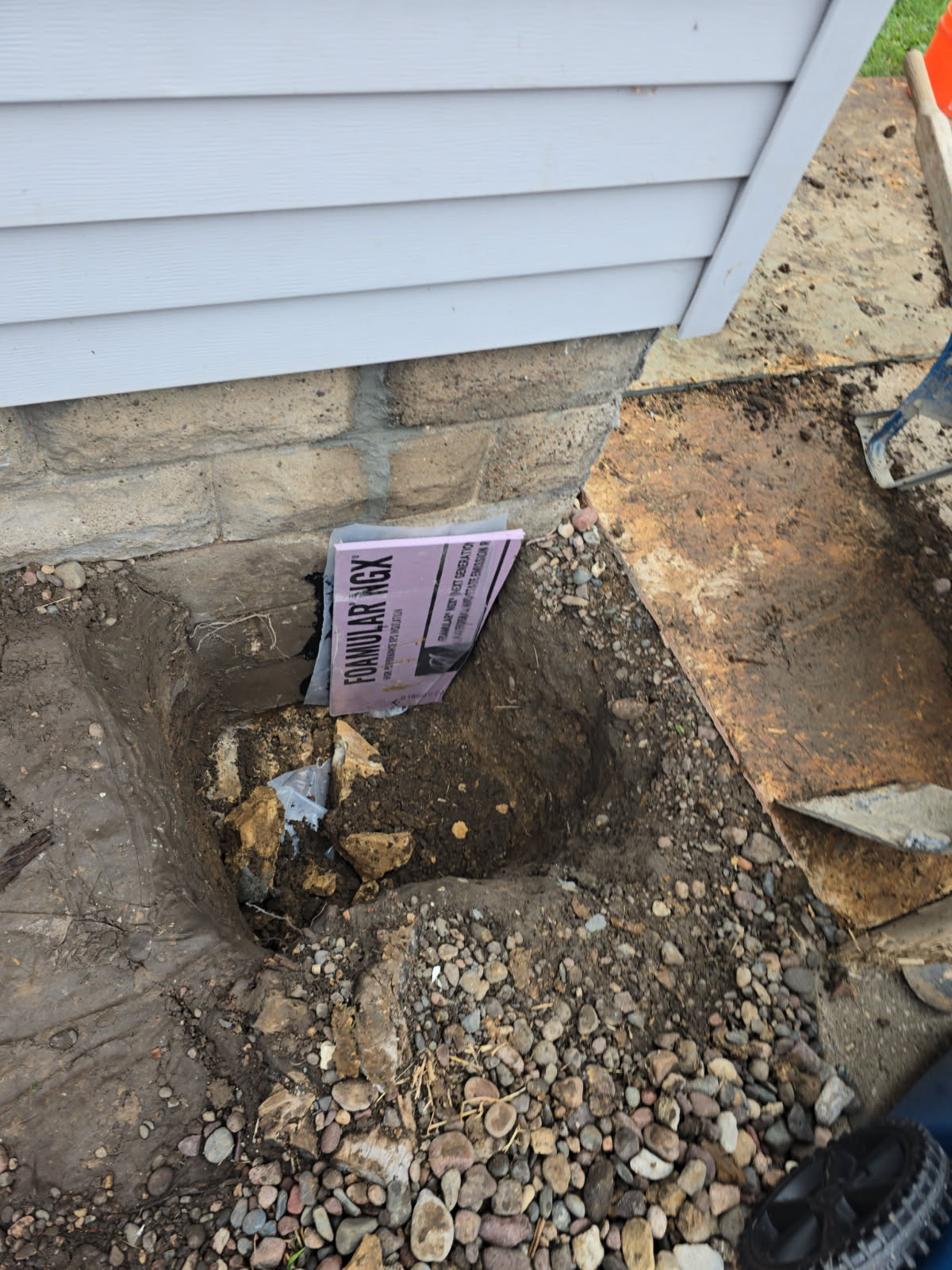 Exterior excavation at the northeast corner for the foundation crack repair