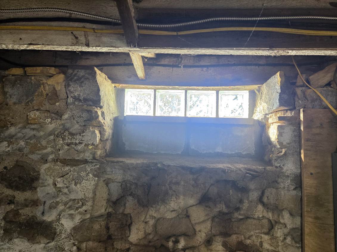 Finished glass block basement window letting in daylight in Davenport