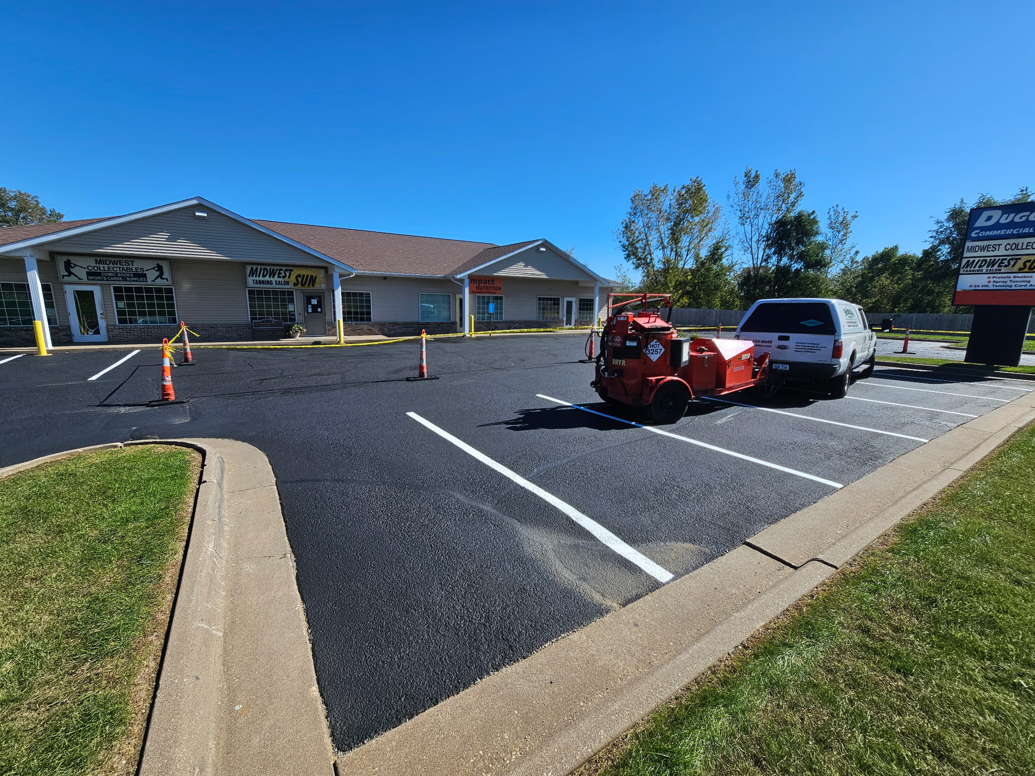 Commercial parking lot in Davenport during the sealcoating and crack-filling project